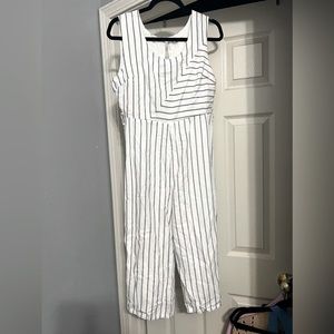 White jumpsuit with navy stripes- open back- size large
